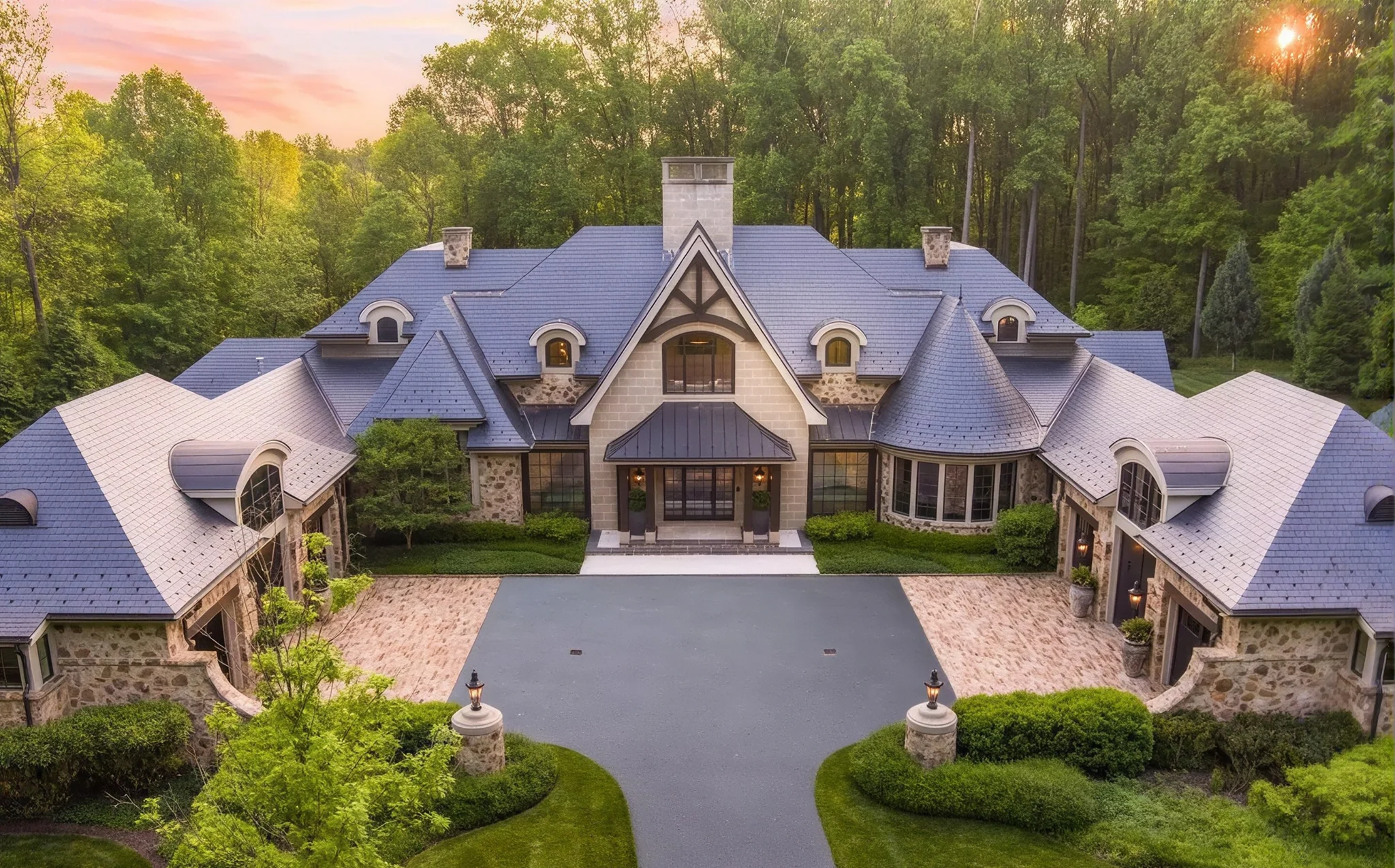 Custom stone home at sunset